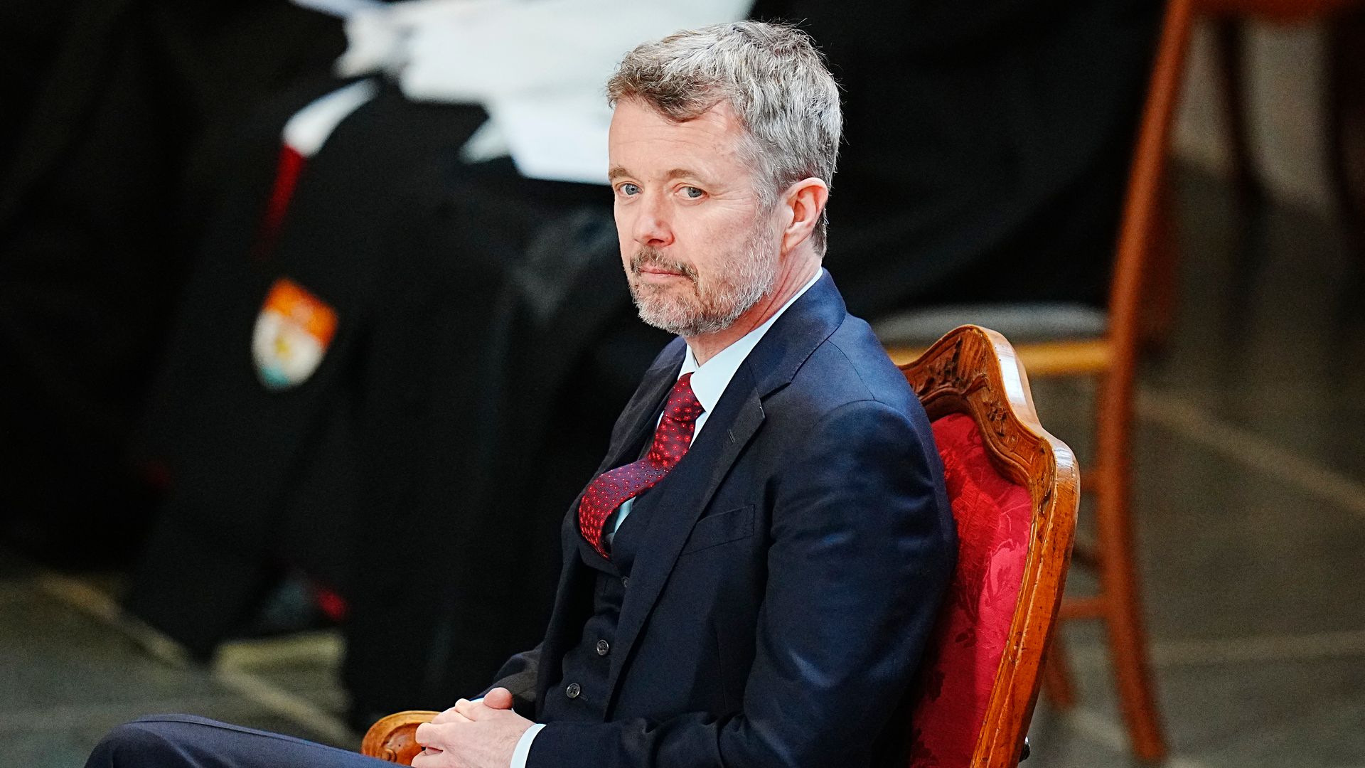 King Frederik seated during church service