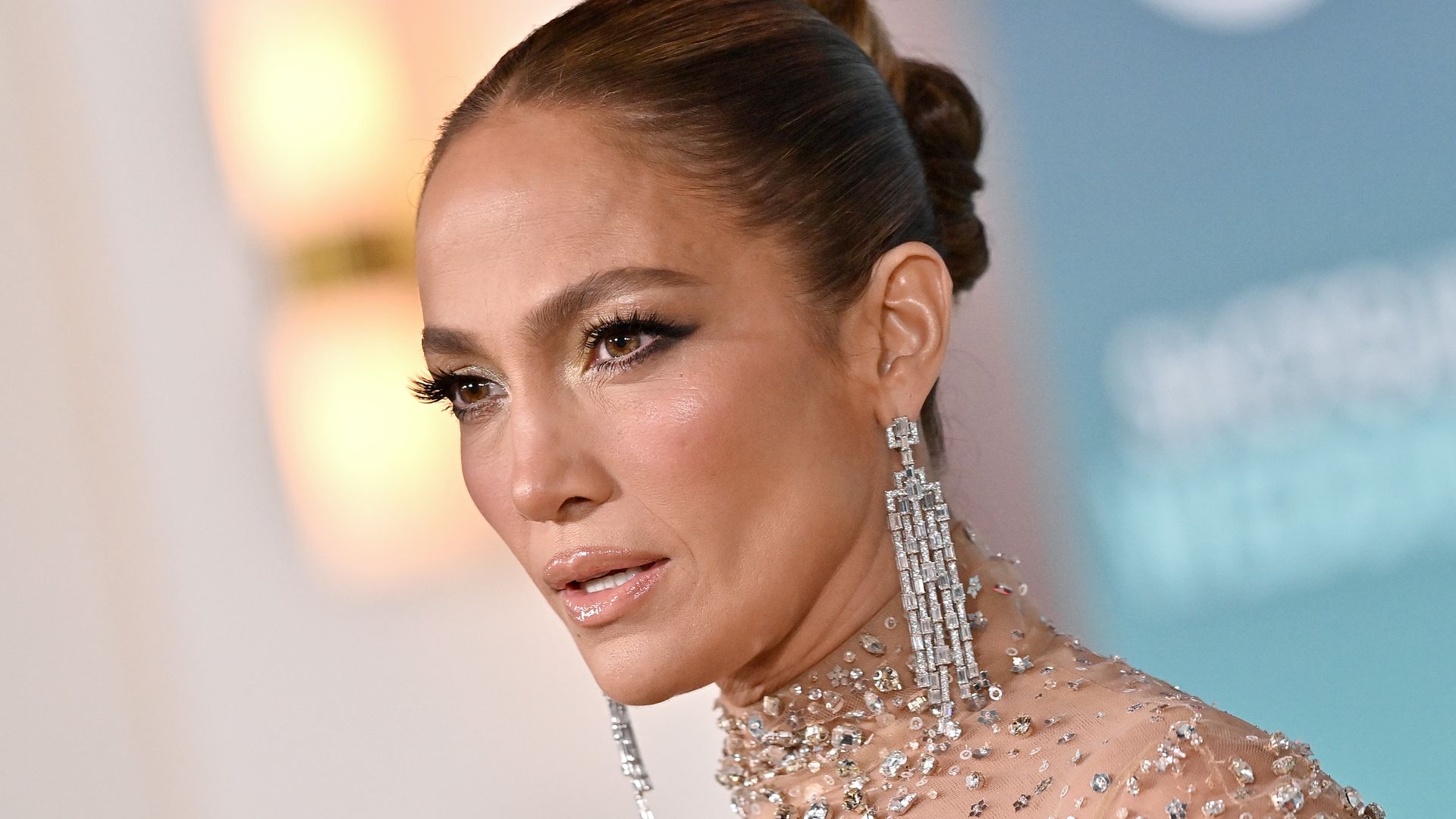 Jennifer Lopez in sparkles with hair in bun