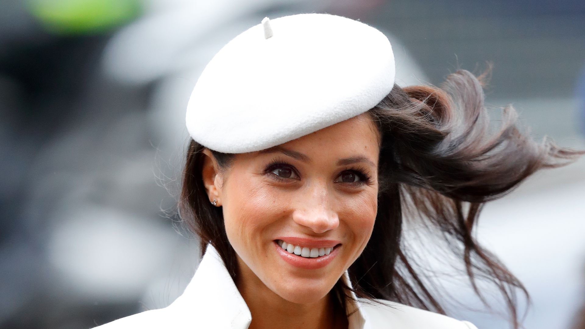 Meghan Markle in white hat and coat
