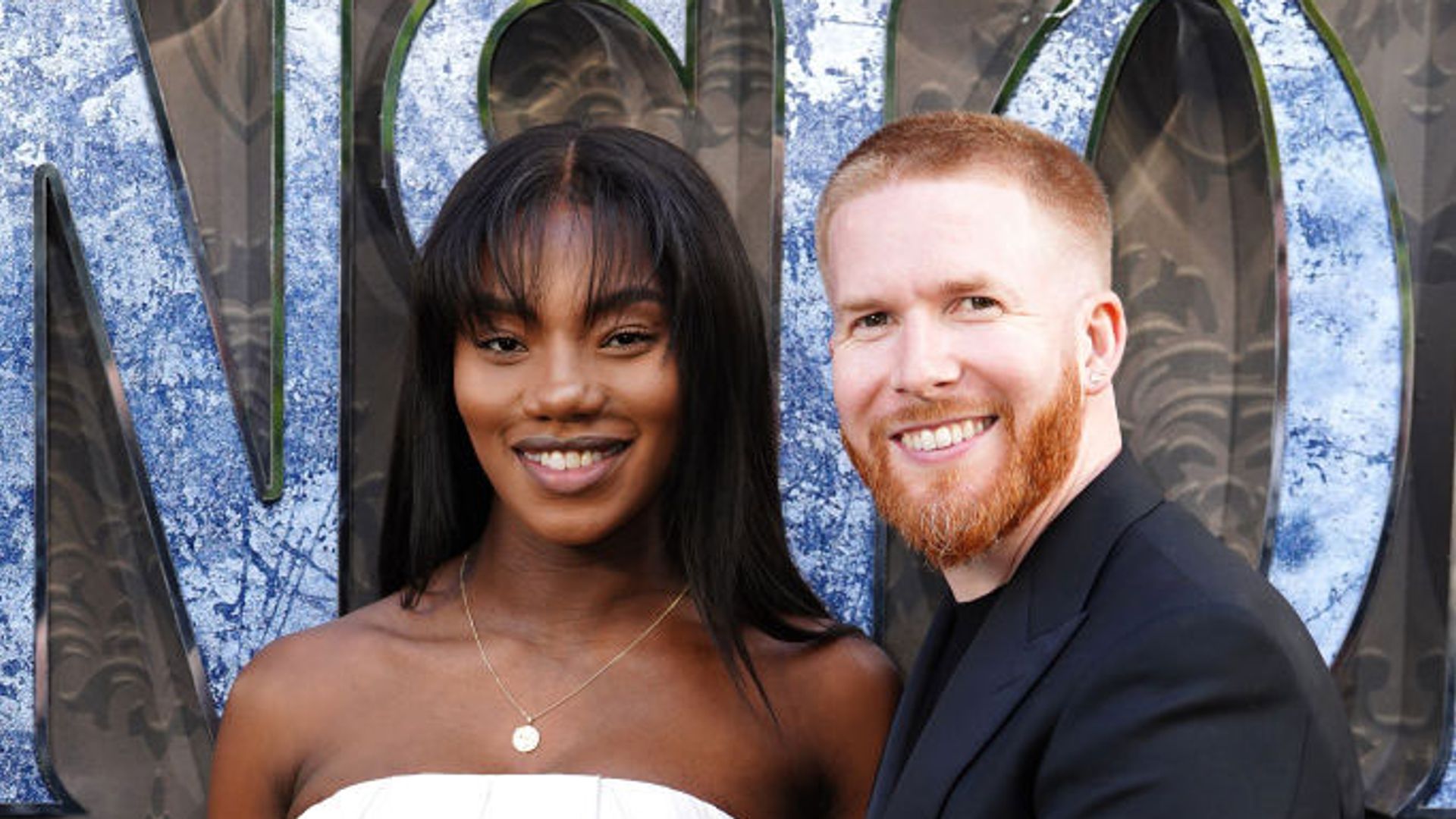 Neil Jones and Chyna Mills at the Haunted Mansion premiere in 2023