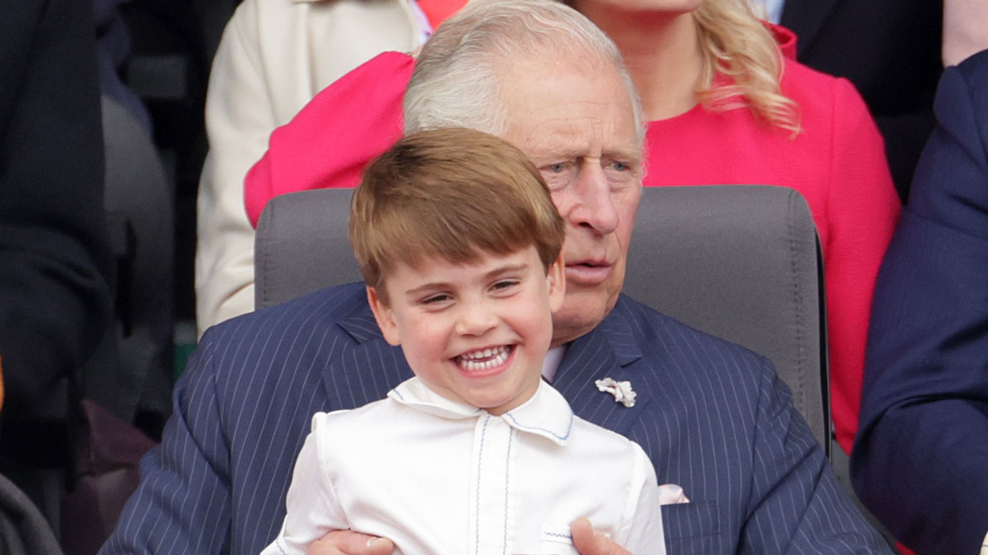 LPrince Louis of Cambridge sits on Prince Charles, Prince of Wales lap during the Platinum Pageant on June 05, 2022 in London