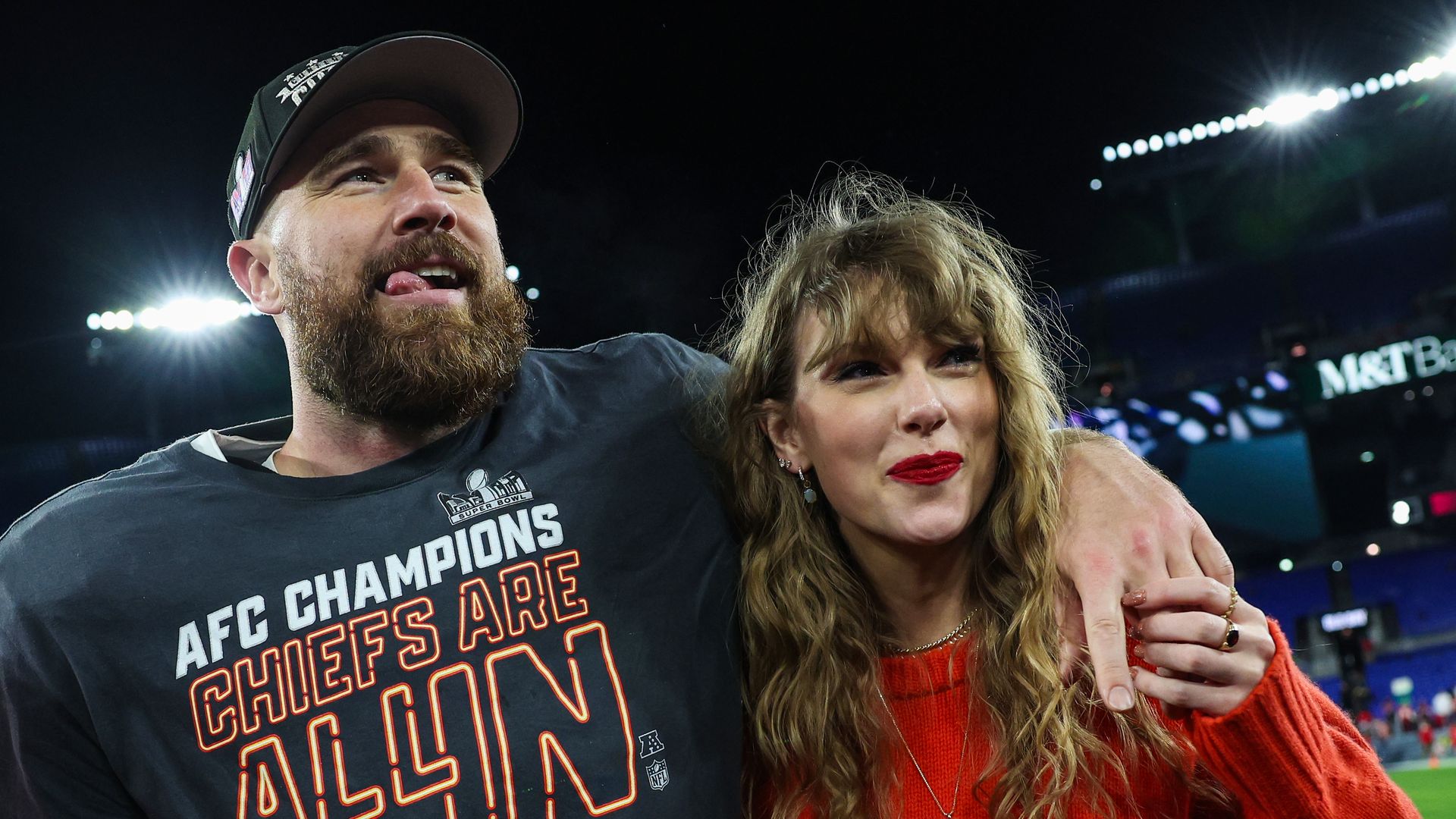 taylor swift travis kelce arms around each other
