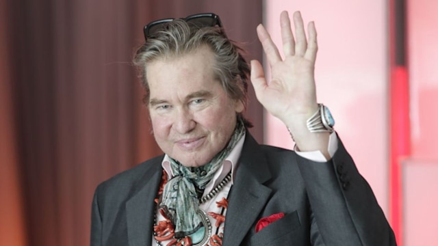 Val Kilmer waves to fans