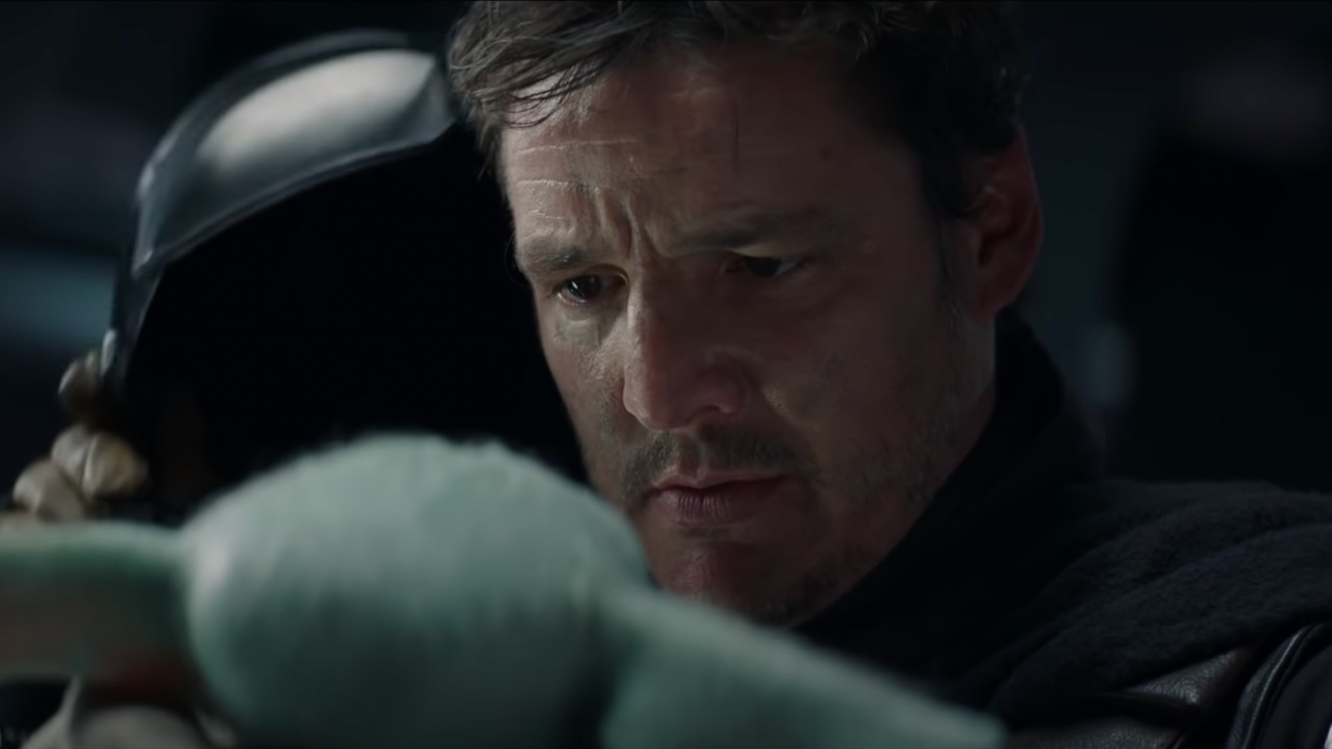 Din shows his face to Grogu in The Mandalorian