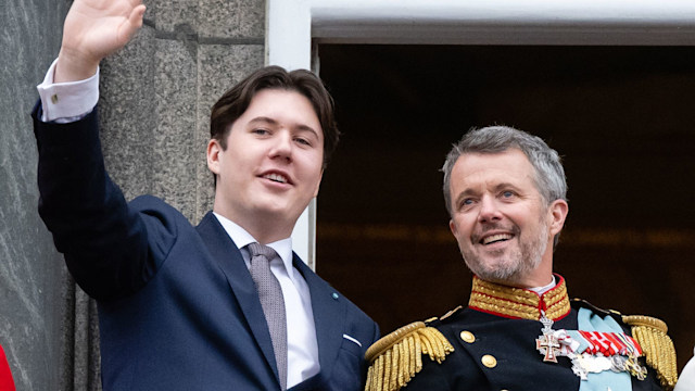 Crown Prince Christian waving alongside King Frederik