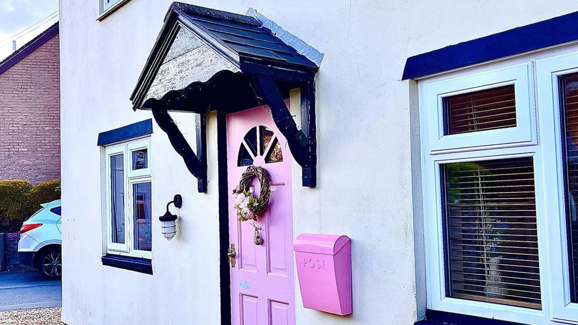 cottage with pink door