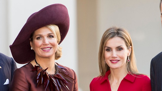 Queen Maxima in brown and Queen Letizia in red