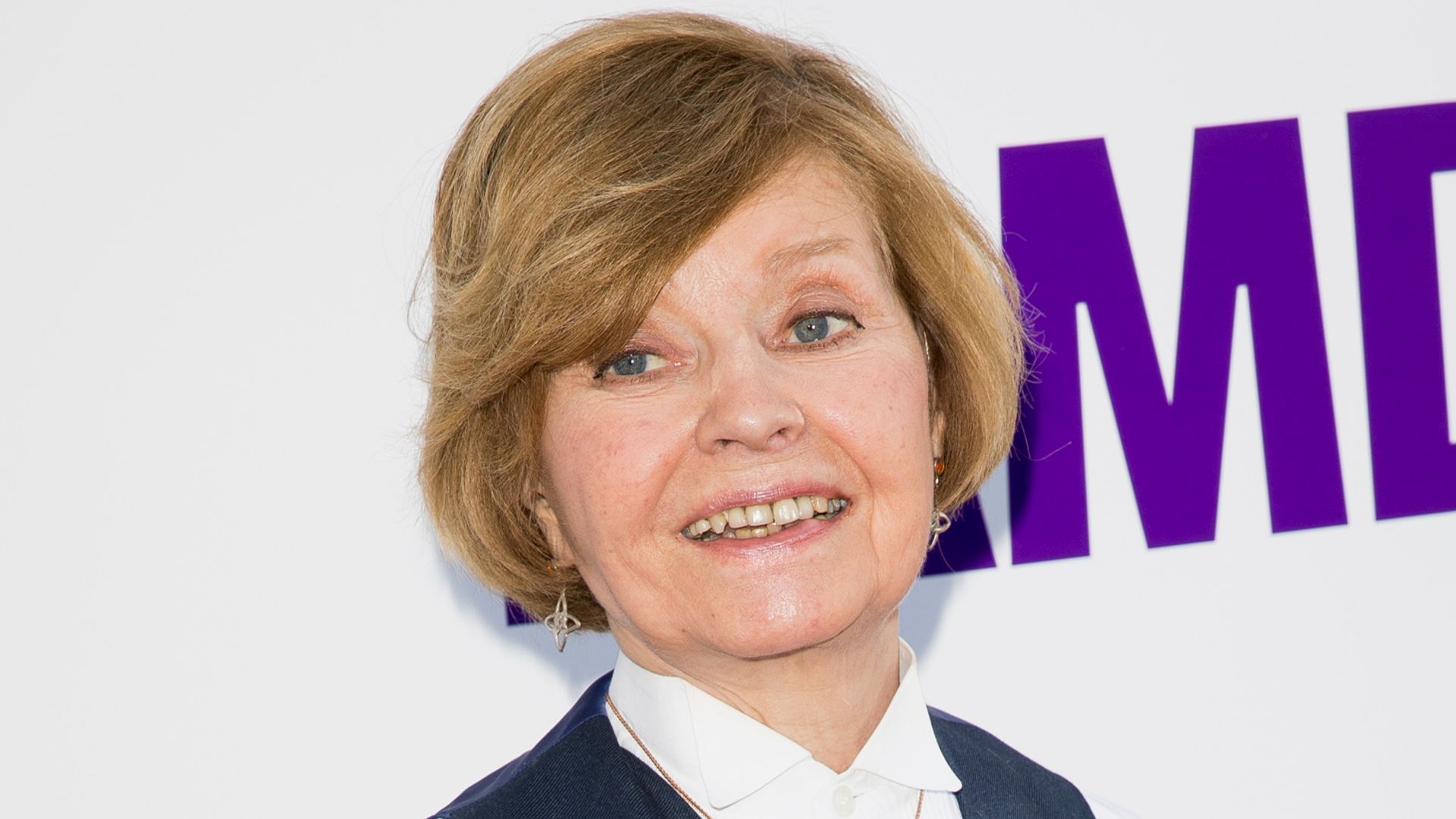 Prunella Scales in a blue and white outfit