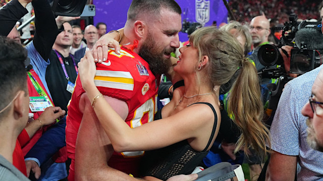 Kansas City Chiefs Travis Kelce (87) kisses girlfriend and singer Taylor Swift following victory vs San Francisco 49ers 