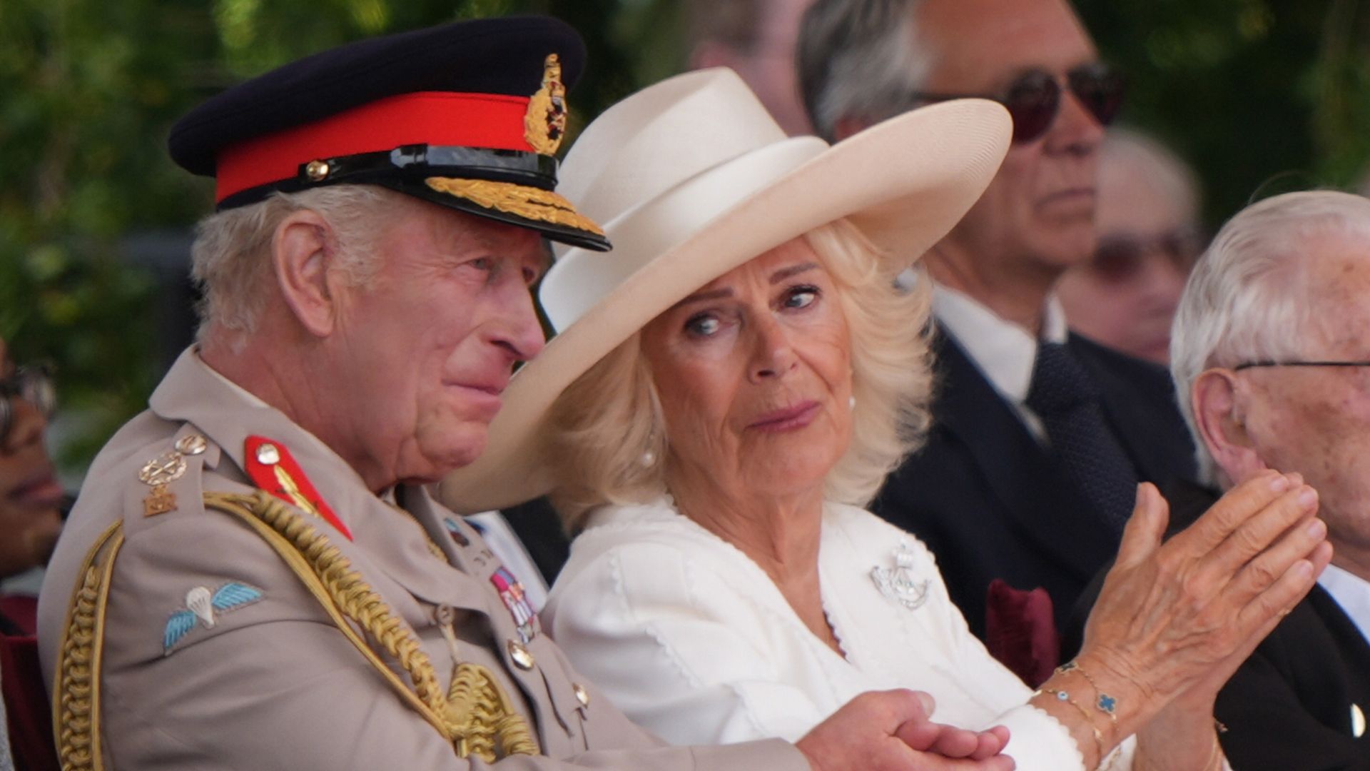 Queen Camilla tears up as veteran salutes King