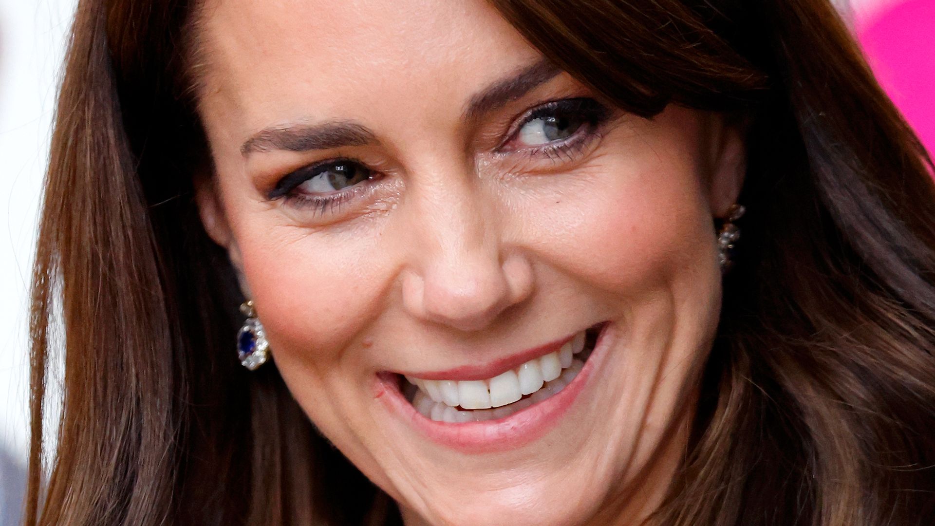 princess kate smiling in blue jacket 