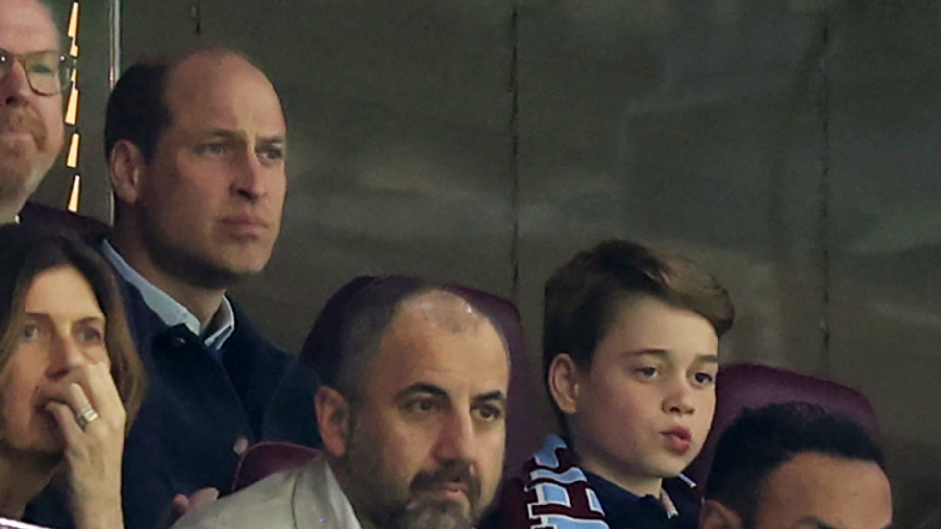 Prince William, Prince of Wales and Prince George of Wales watch from the stands during the UEFA Europa Conference League 2023/24 Quarter-final first leg match between Aston Villa and Lille OSC 