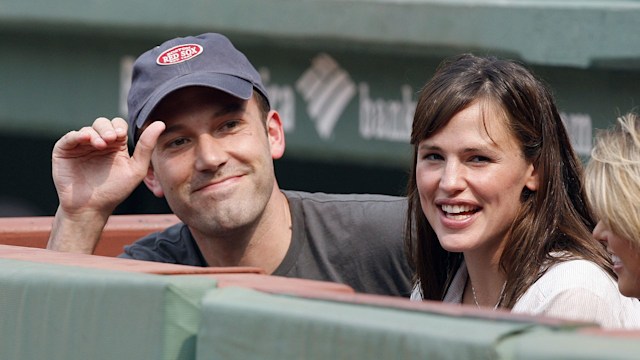 photo of ben affleck and jennifer garner sitting in dugout