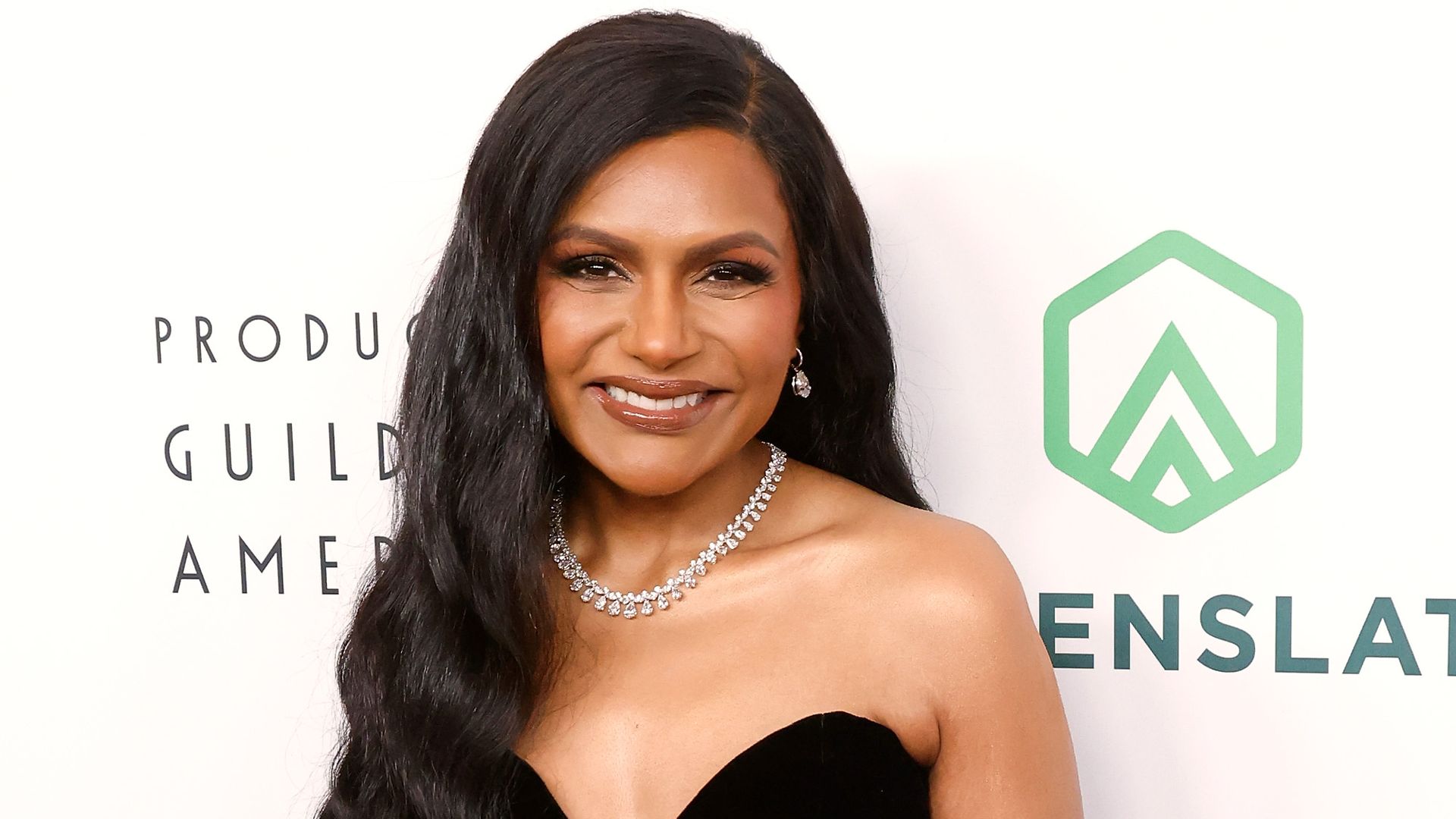 Mindy Kaling highlights body transformation in slinky black swimsuit