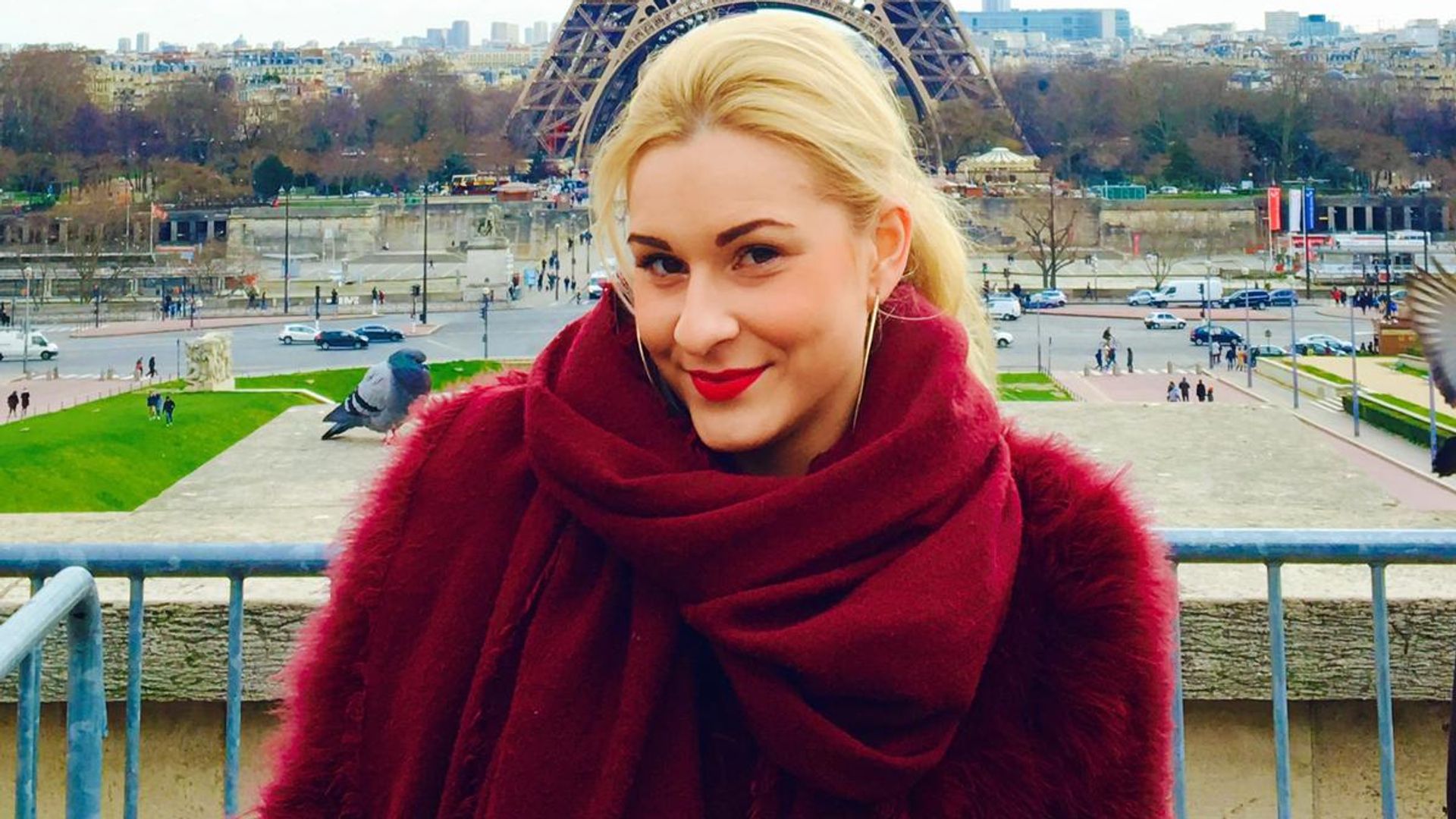 Blonde woman standing in Paris