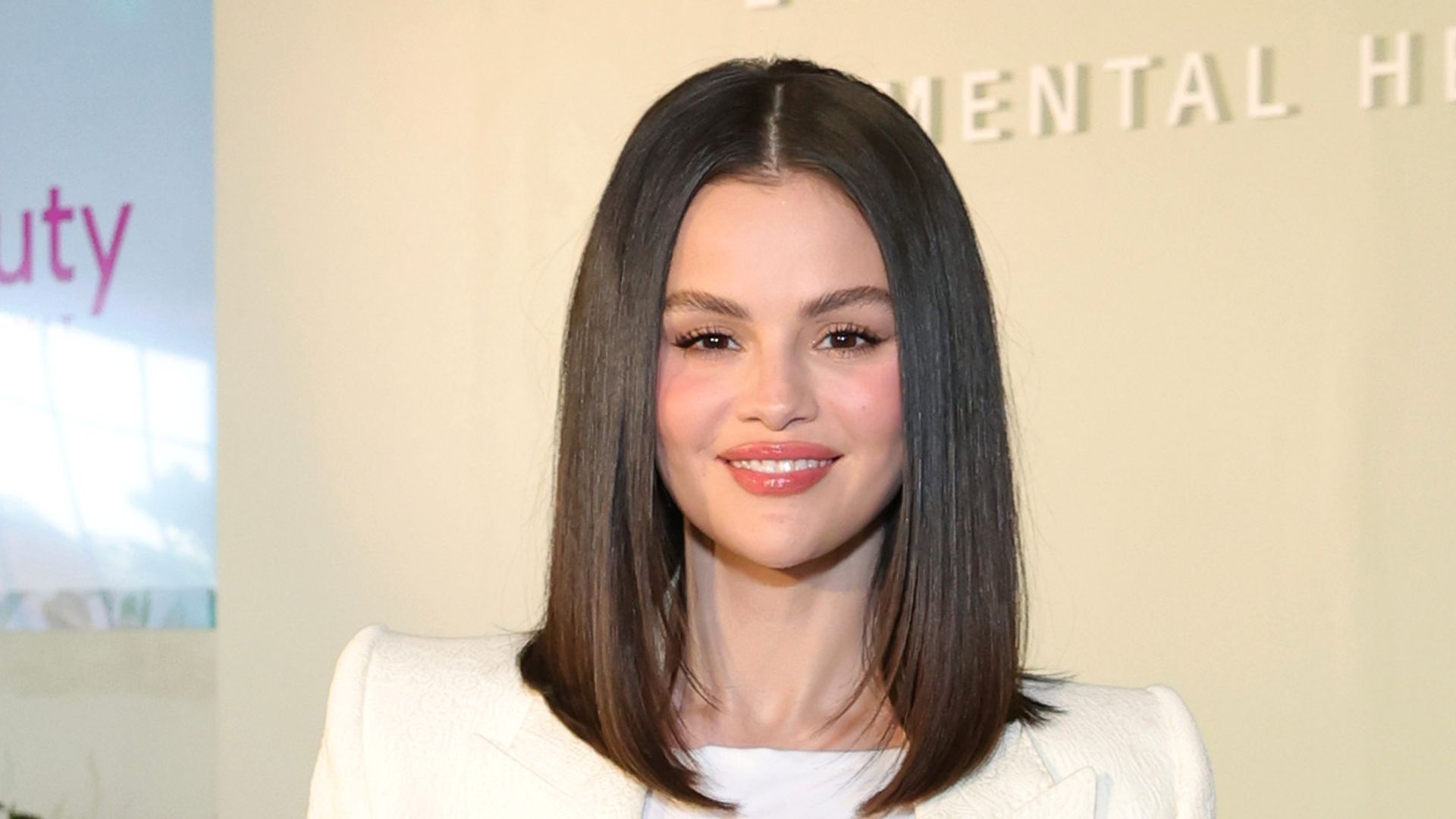 Selena Gomez's leather dress and boots combo is a spring layering dream