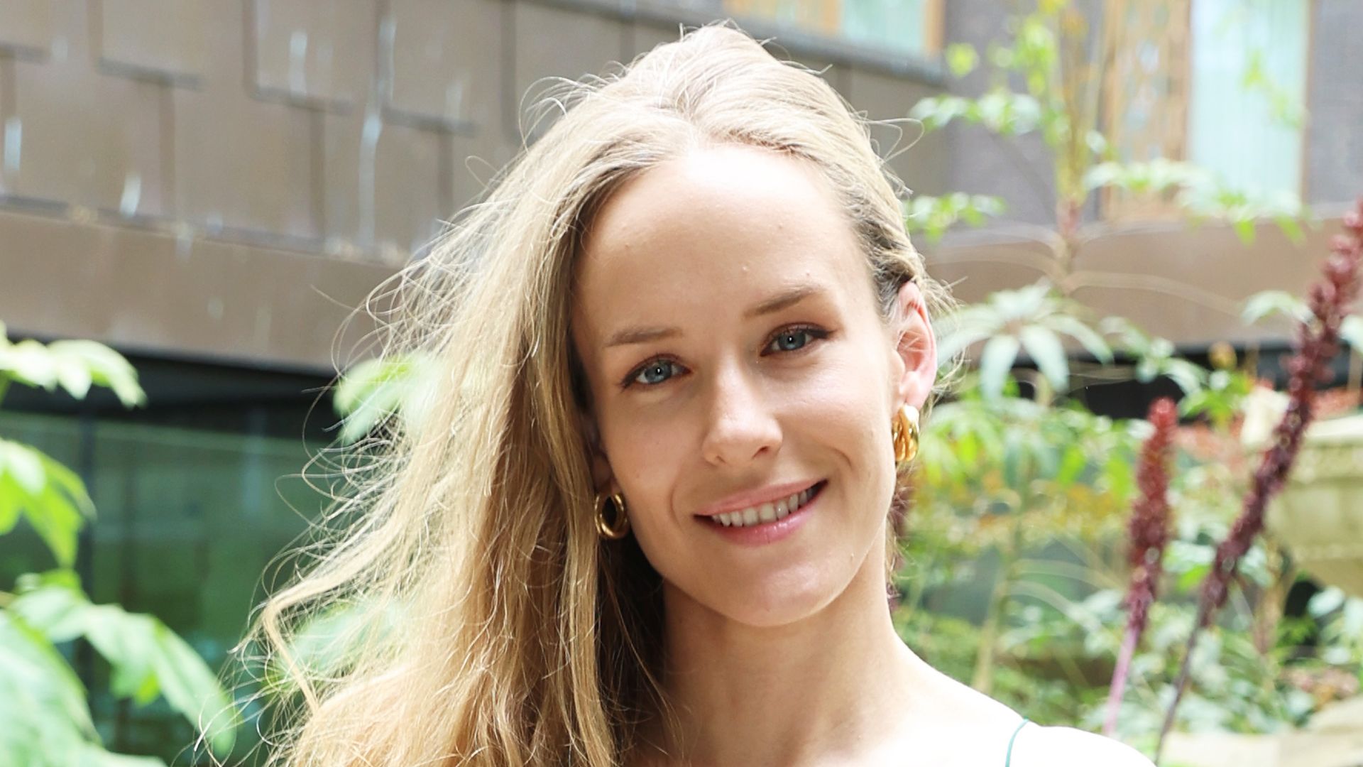 Hum Fleming outside in strappy dress