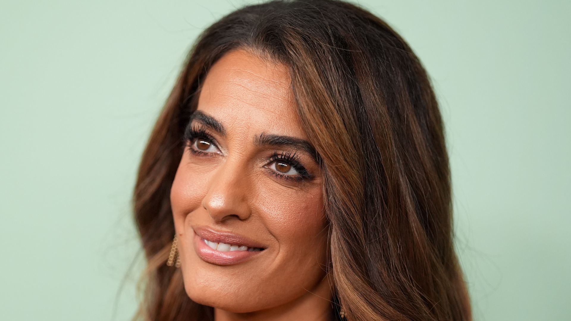 Amal Clooney in strapless dress shoulders up