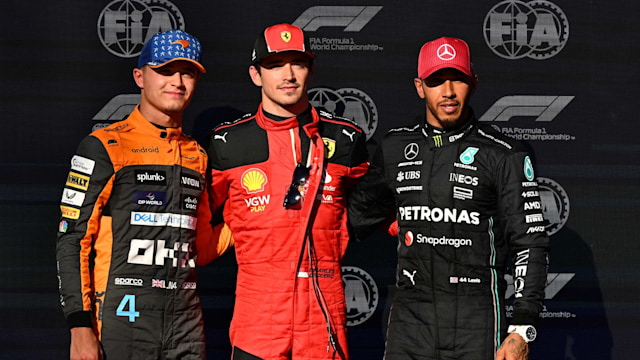 Lando Norris, Charles Leclerc and Lewis Hamilton standing in a line