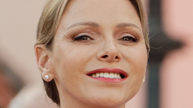 Princess Charlene smiling shoulders up in pink dress