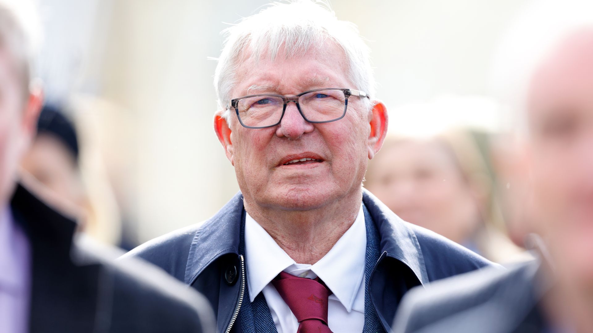 Sir Alex Ferguson watches his horse 'Caldwell Potter' run in and win the Jack Richards Novices' Limited Handicap Chase