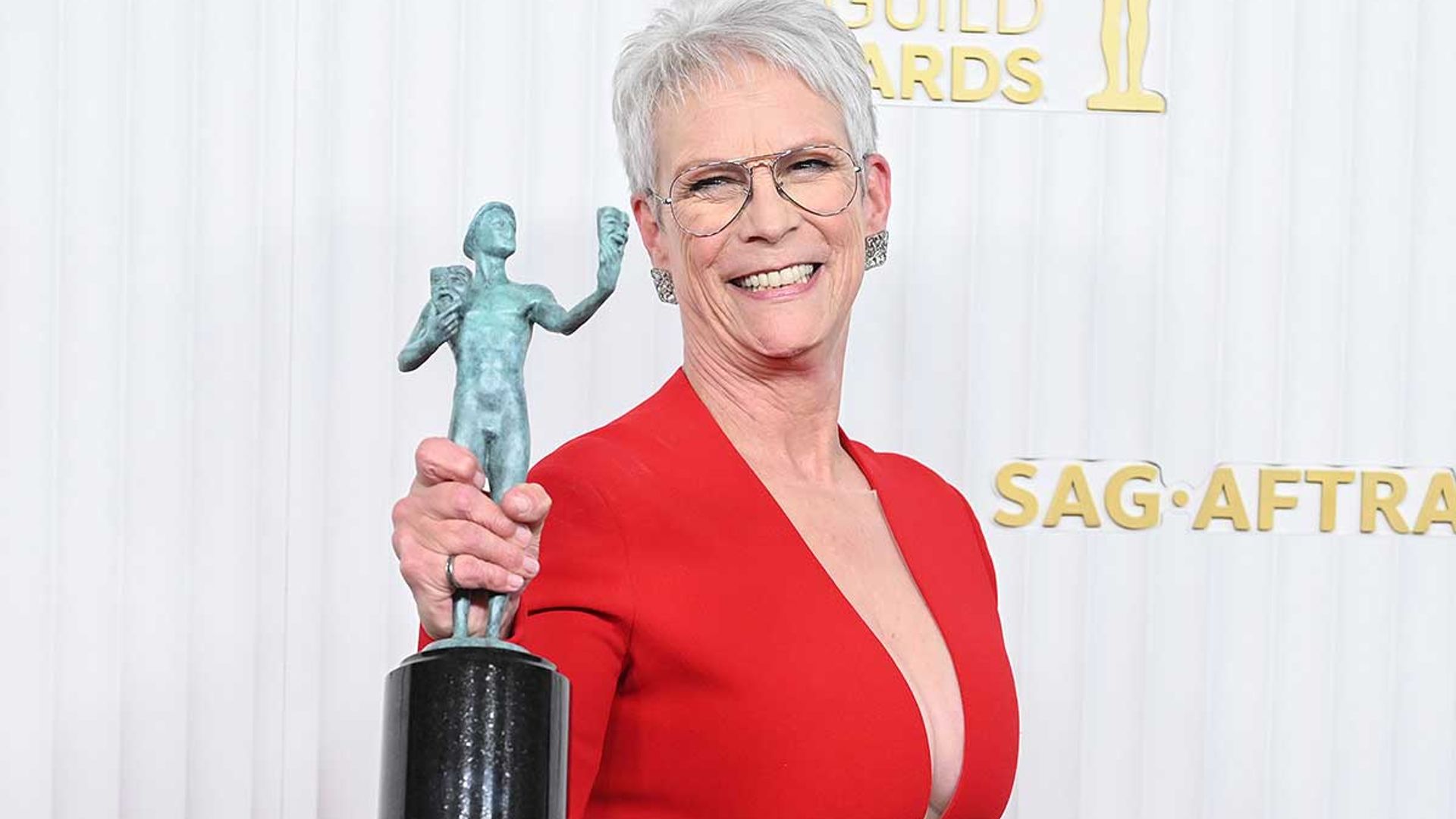 Jamie Lee Curtis wows in plunging red dress at SAG awards as she
