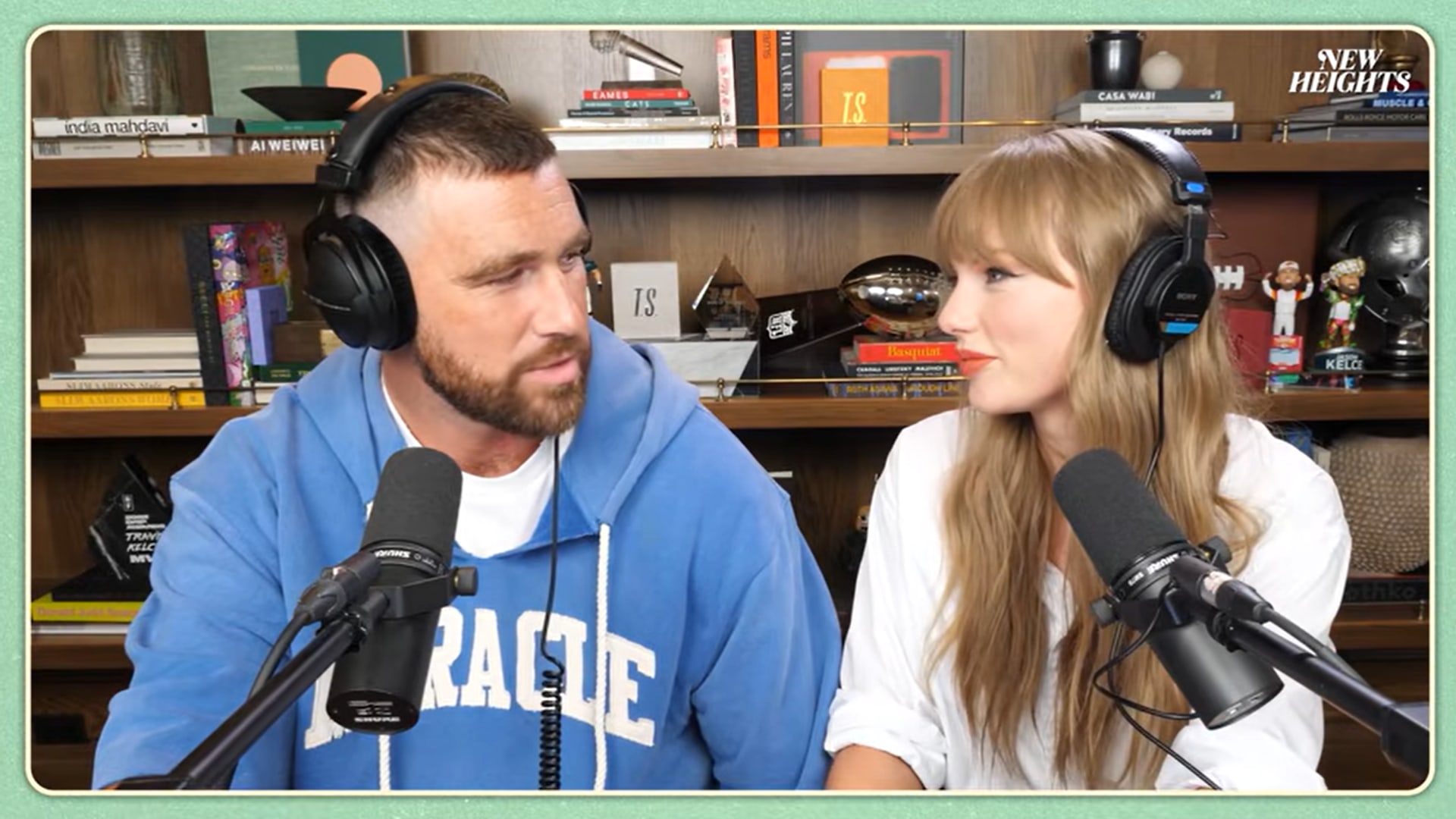 Taylor Swift looks at Travis Kelce on the New Heights podcast