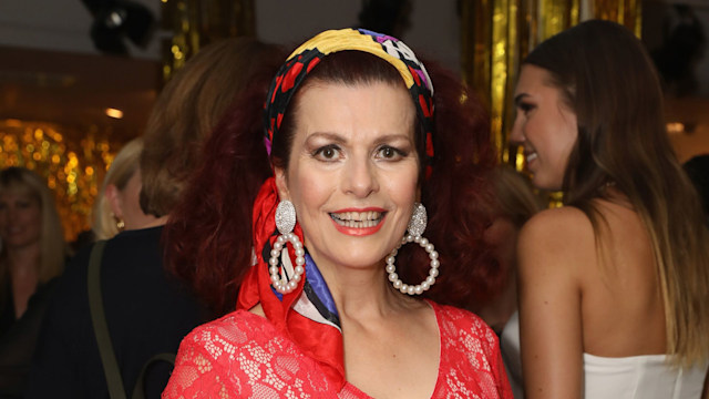 Cleo Rocos in lace red dress