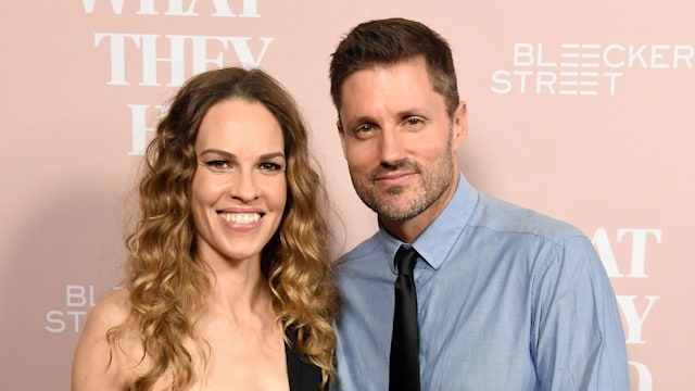 hilary swank philip schneider arms around each other red carpet