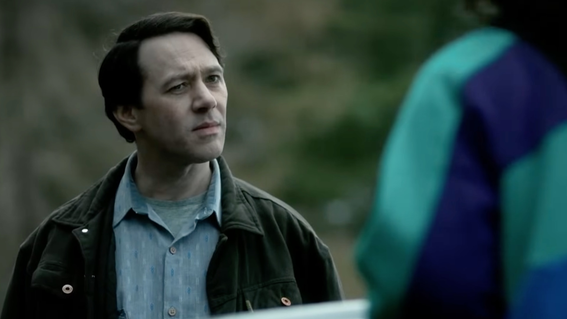 Man standing next to car