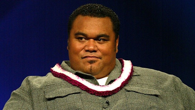 peter navy tuiasosopo sitting in chair on stage
