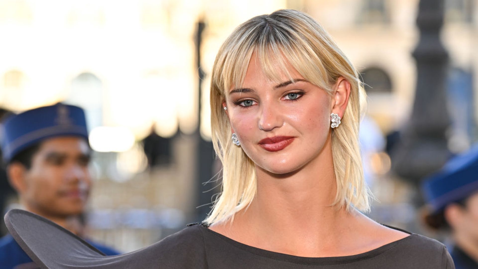 Mia Regan wearing an off the shoulder jumper 