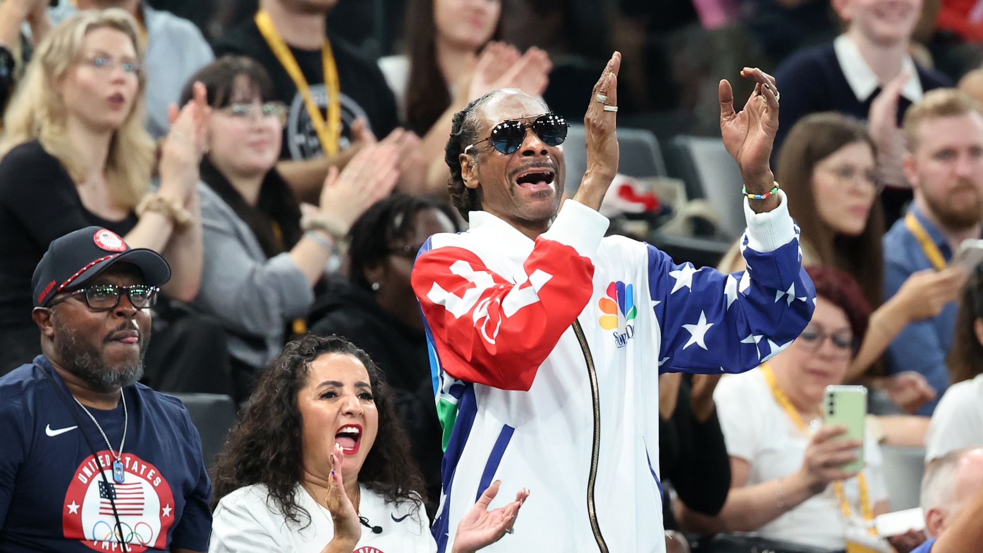 Rapper Snoop Dogg cheers on the U.S. team during qualifying for women's team gymnastics at the 2024 Olympic Games in Paris, France, on Sunday.