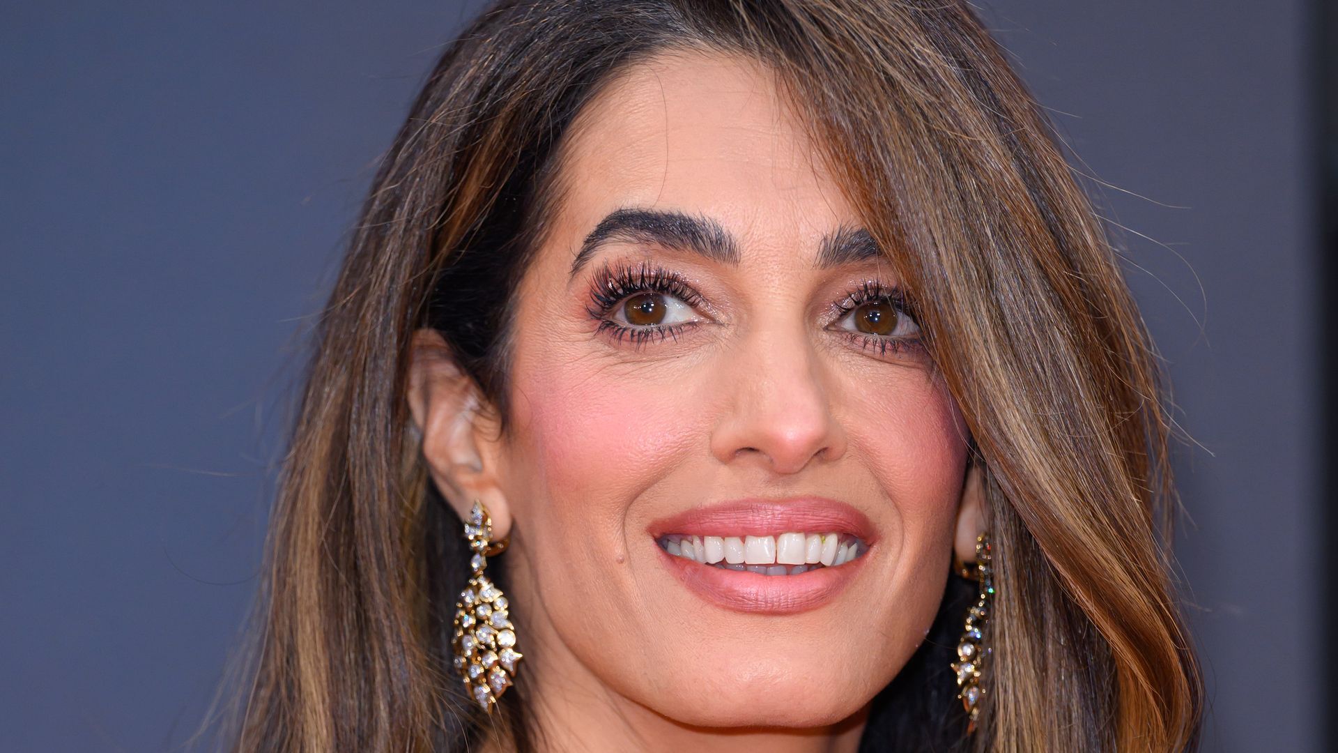 Amal Clooney posed in strapless pink dress
