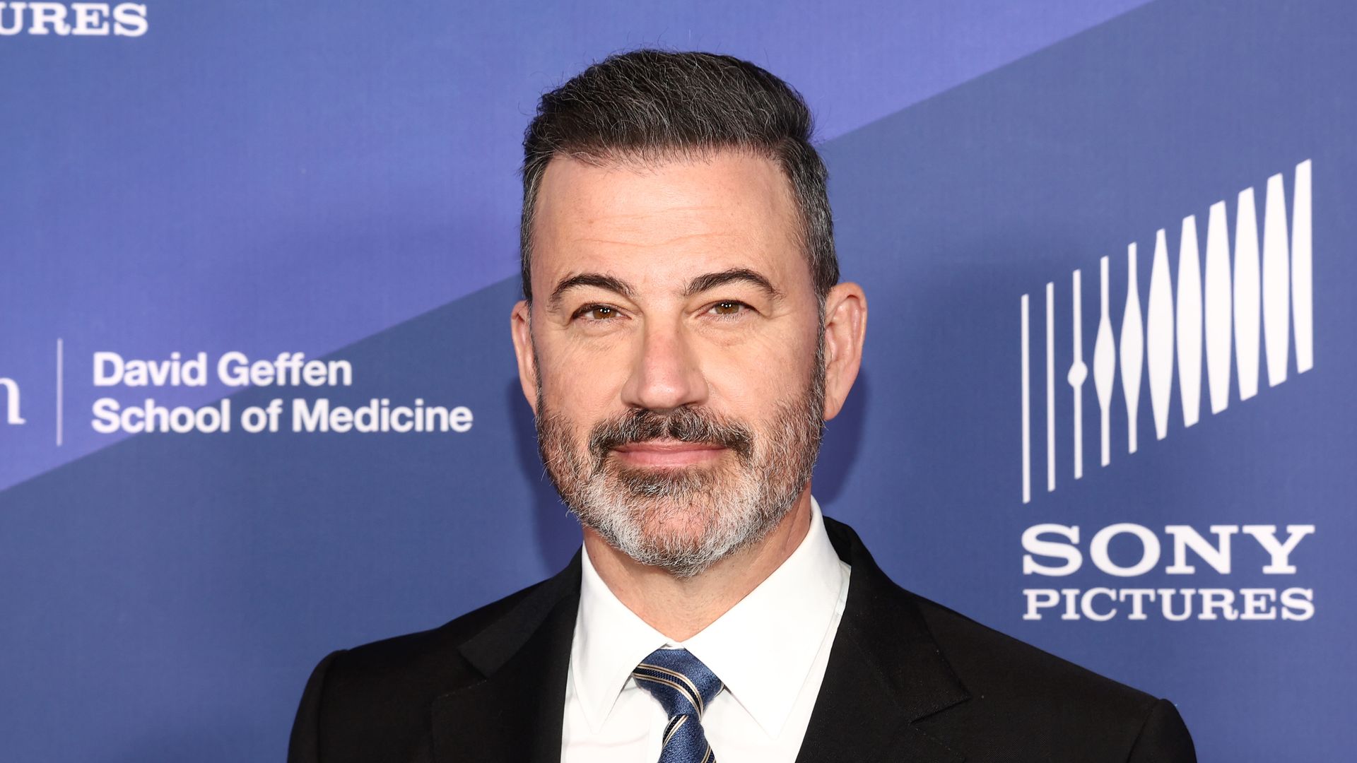 photo of jimmy kimmel in dark suit and white shirt