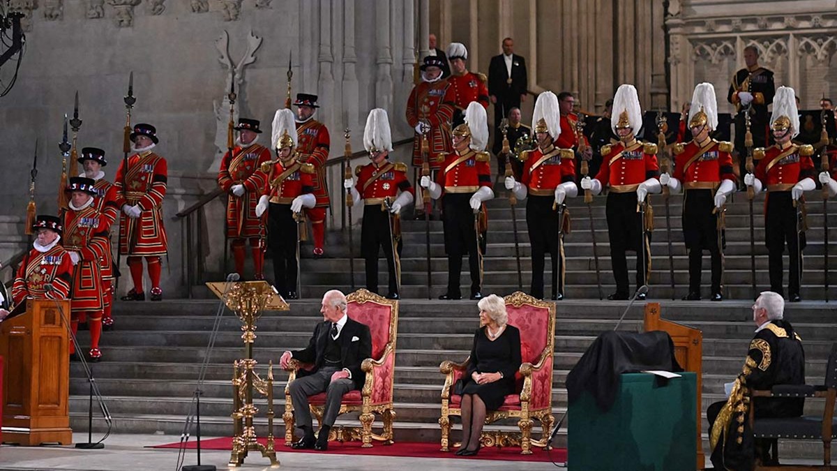 King Charles III takes the throne with the Queen Consort next to him in ...