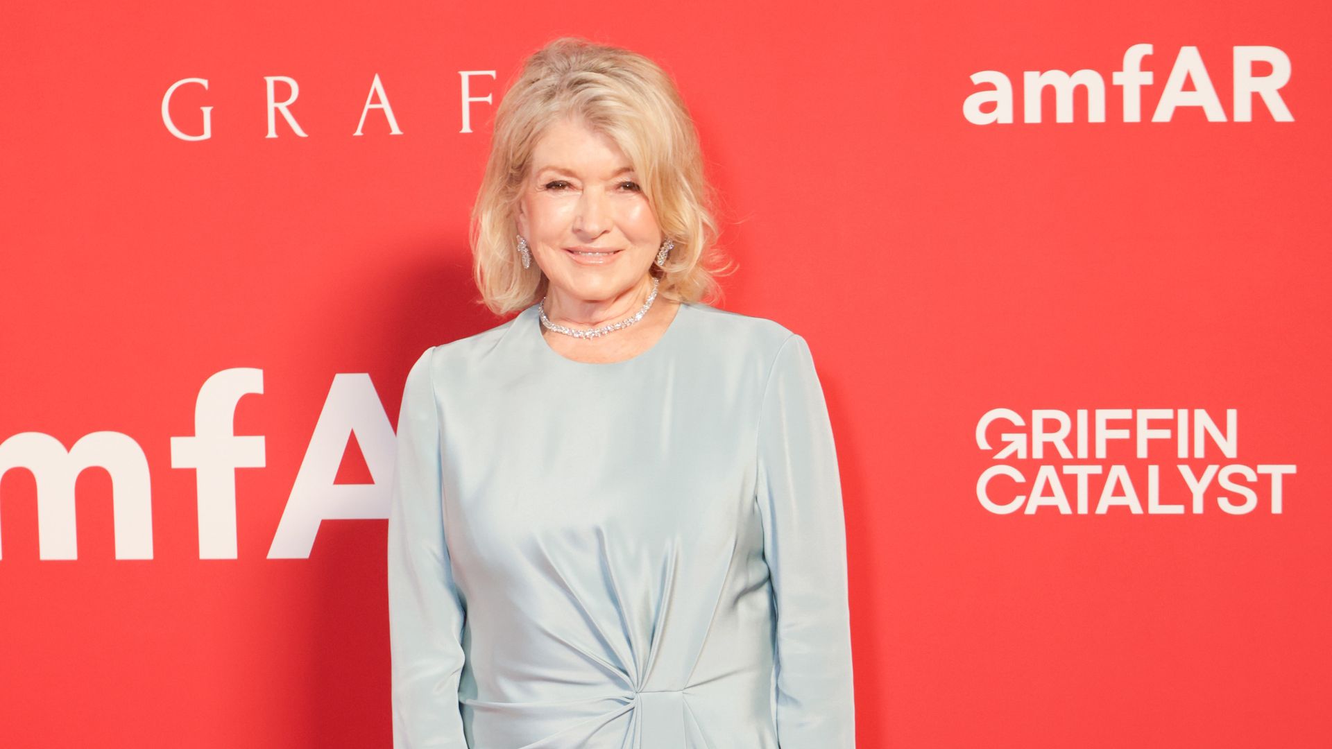 Martha Stewart stuns in a slinky gown at amfAR gala as she proves age is just a number