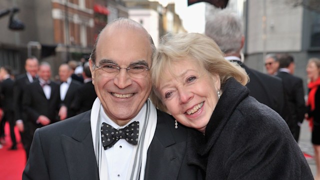 David Suchet and wife Sheila Ferris cuddle up at the Olivier Awards 2012