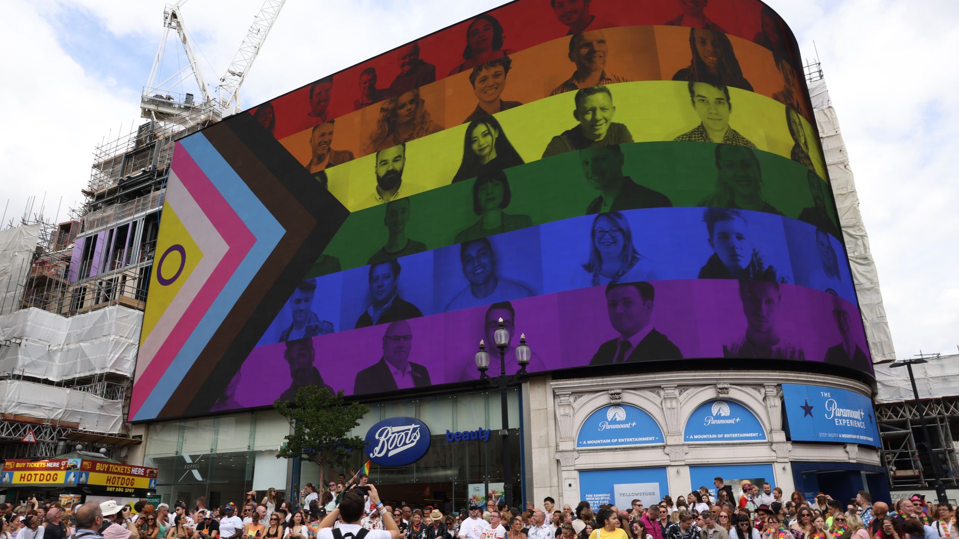 A billboard featuring the Pride Progress flag