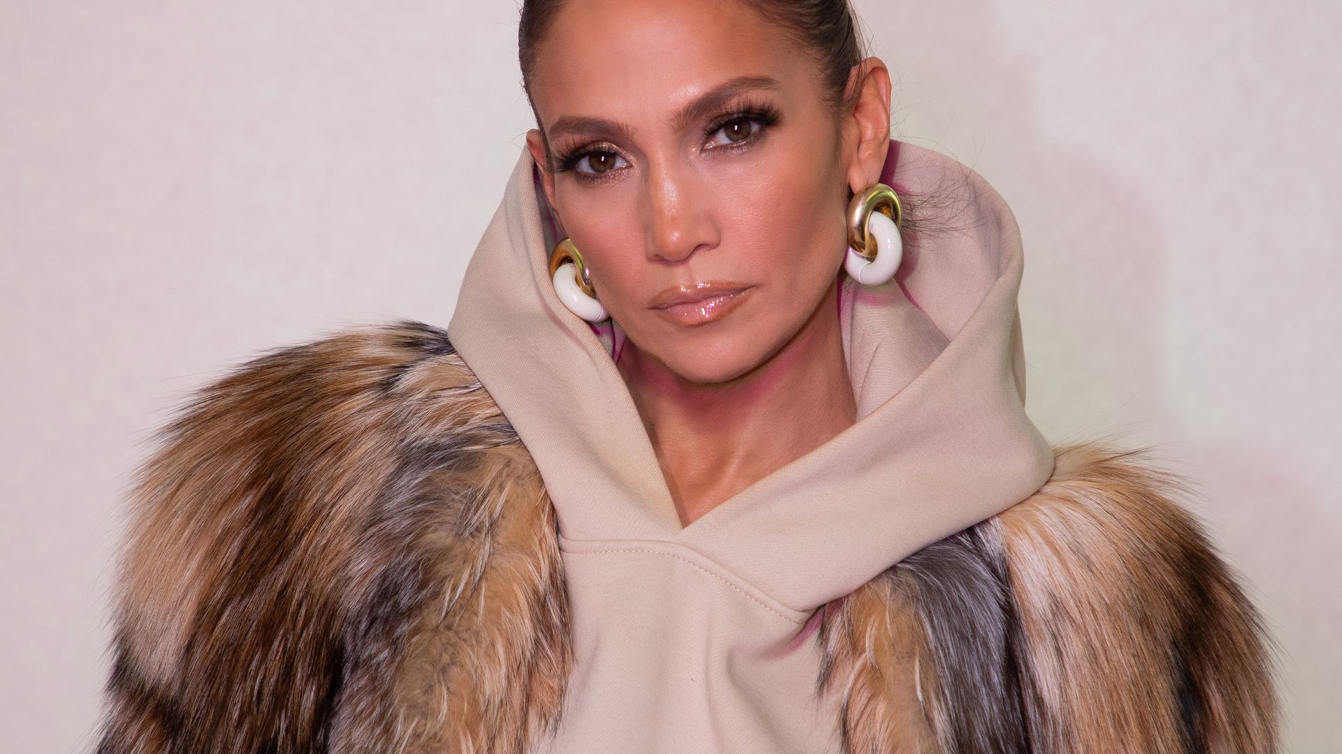 jennifer Lopez with hair up in fur coat