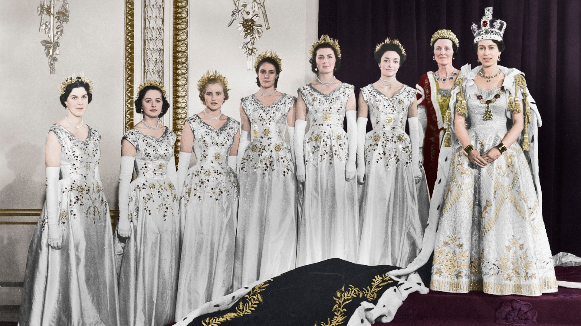 HM Queen Elizabeth II with her maids of honour, Green Drawing Room, Buckingham palace, 2nd June 1953. In selecting six Maids of Honour instead of pages to bear her velvet train throughout the Coronation ceremony, the Queen followed the precedent of Queen 