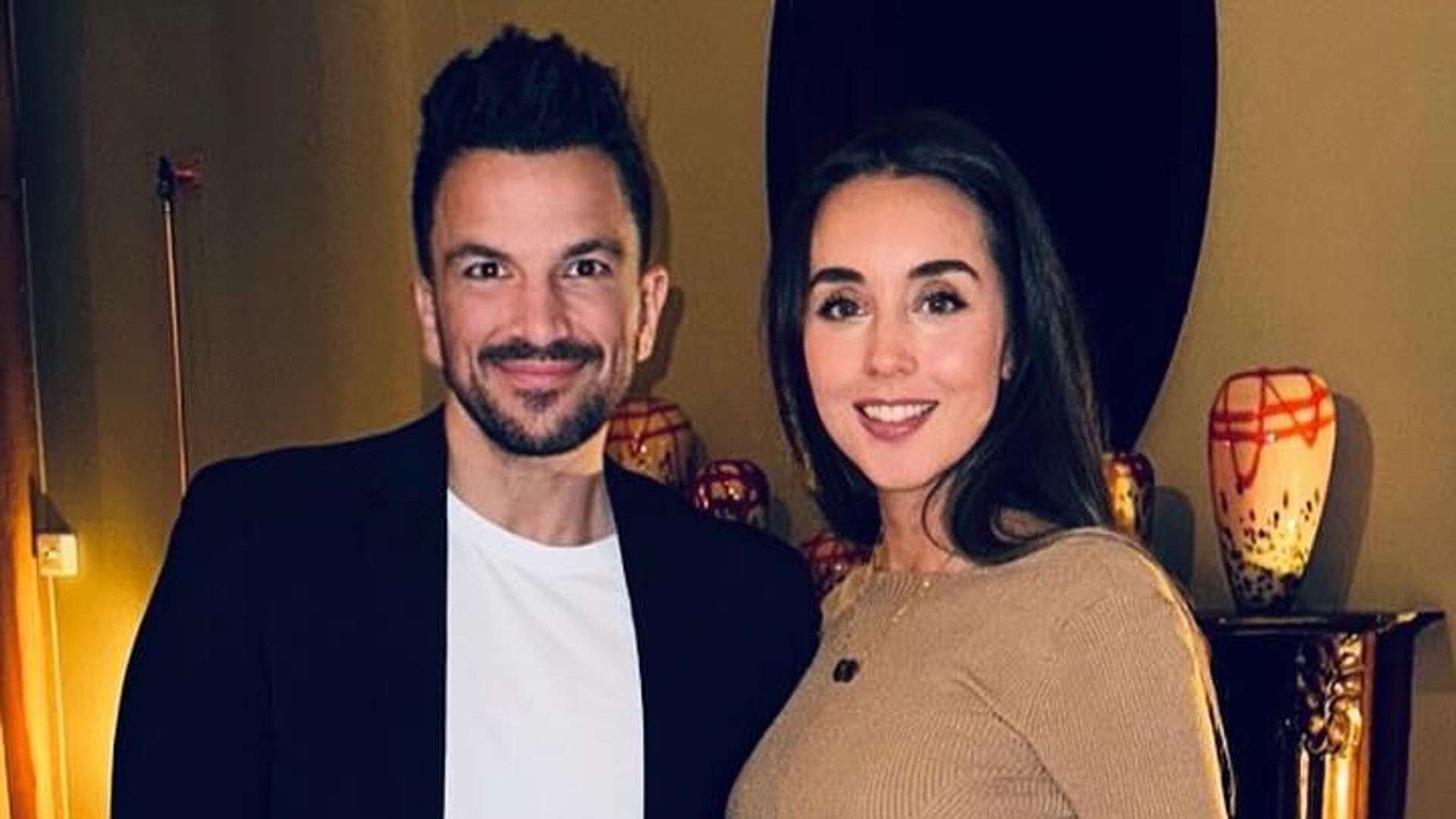 Peter Andre and pregnant wife Emily Andre posing in house 