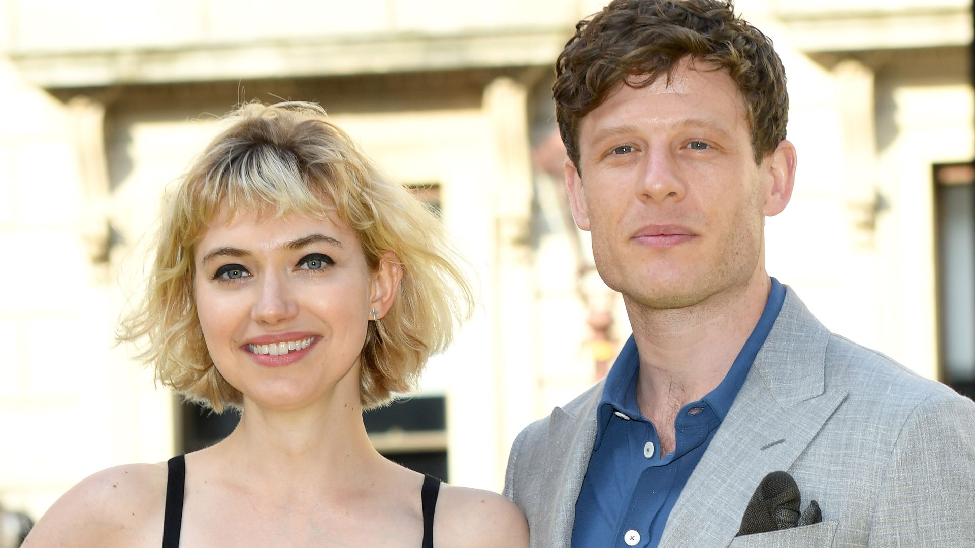Imogen Poots in a black dress with James Norton