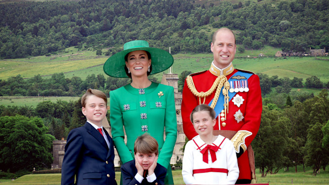 Prince George, Prince Louis, Princess Charlotte standing with their parents