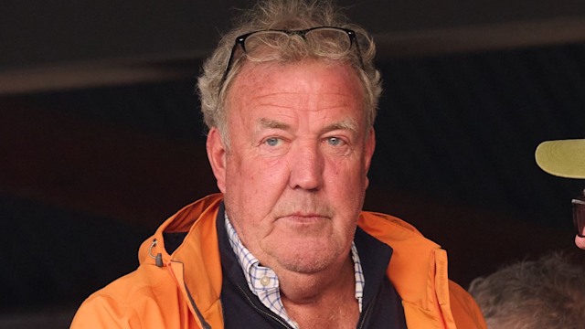 Jeremy Clarkson looking serious in an orange jacket