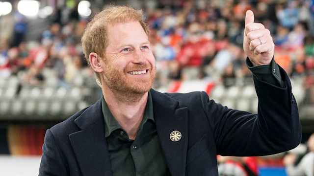 Prince Harry acknowledges fans prior to the start of a TV interview during pre-game festivities before the start of the 2024 Grey Cup 