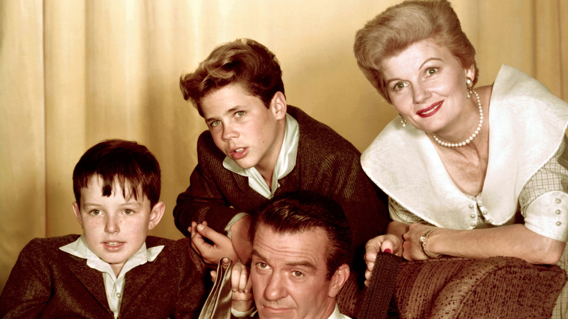LEAVE IT TO BEAVER cast members clockwise from top right: Barbara Billingsley as June Cleaver, Hugh Beaumont as Ward Cleaver, Jerry Mathers as Beaver (Theodore) Cleaver, and Tony Dow as Wally Cleaver. Celebrating Father's Day.
