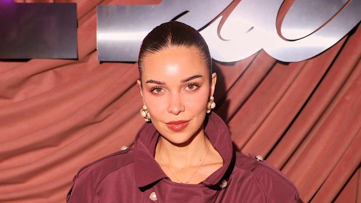 Jackie Apostel takes cues from Victoria Beckham in oxblood trench coat and leather accessories