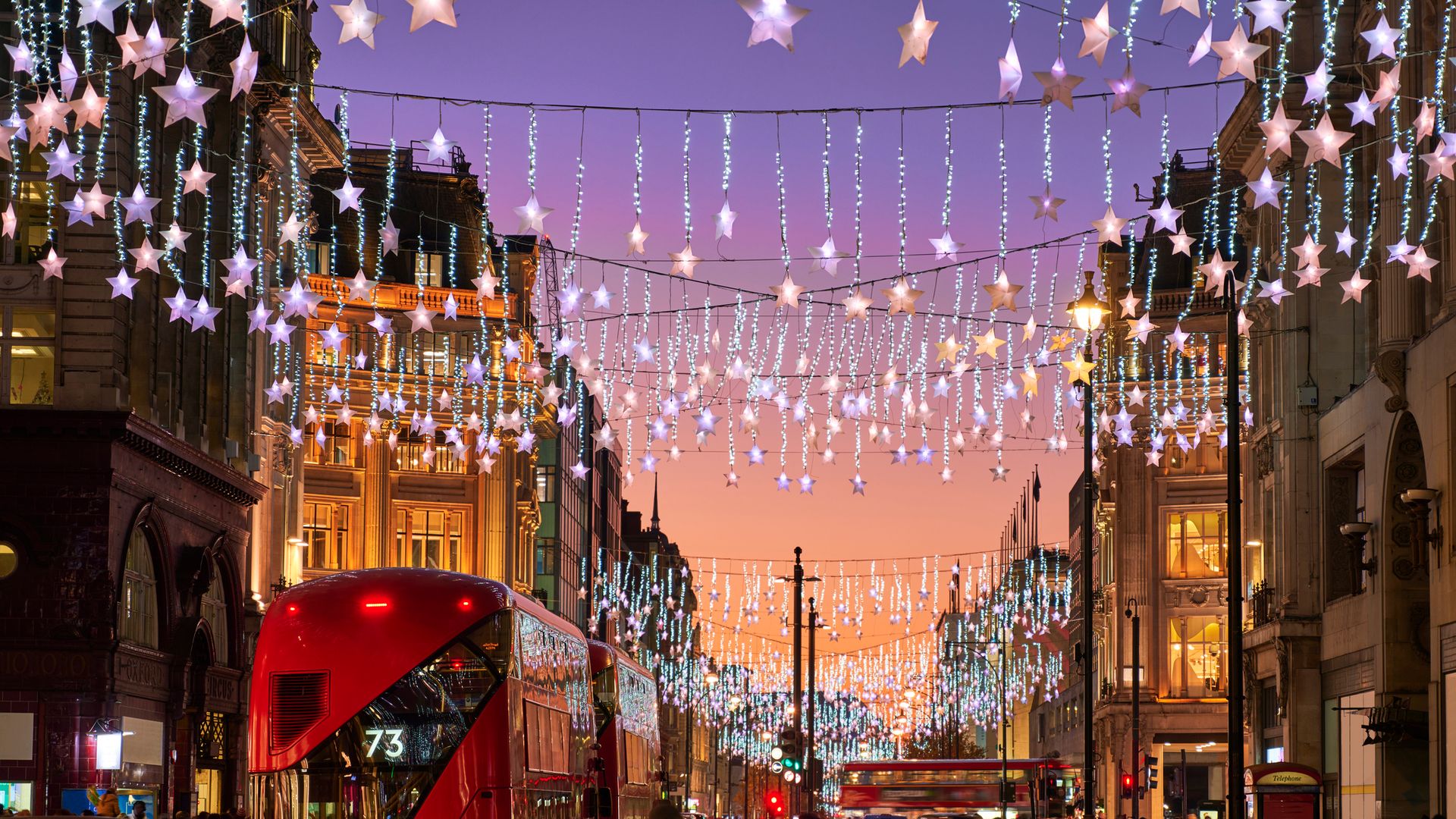 UK, London, Oxford Street, busy street at Christmas with lights at dusk