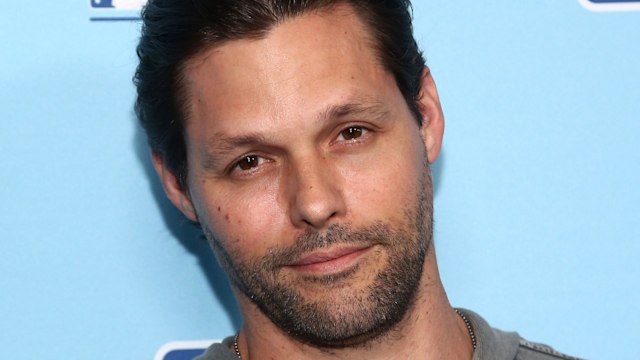 Close up of Justin Bruening wearing a grey top